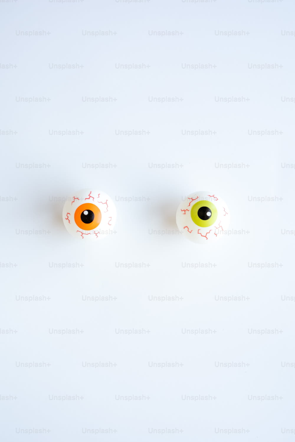 a pair of fake eyeballs sitting on top of a table