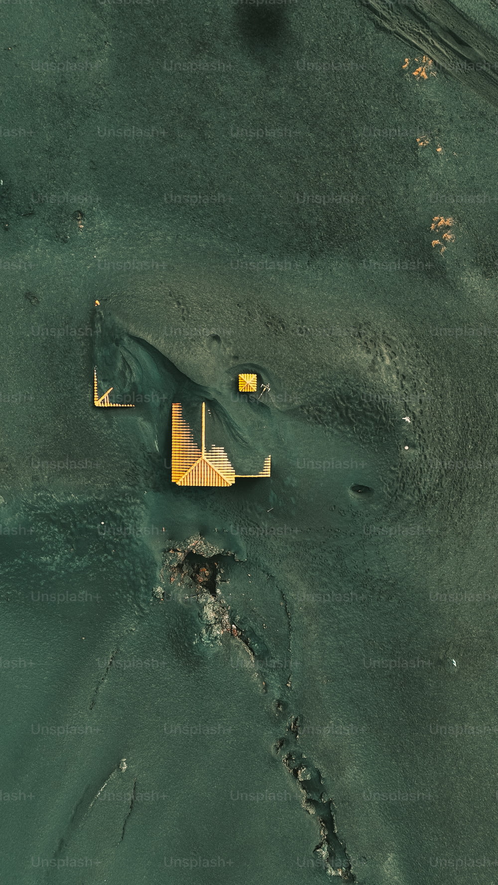 an aerial view of a building in the water