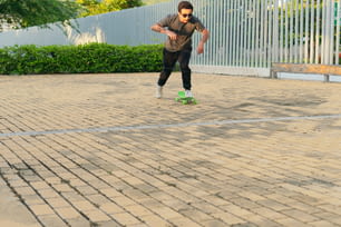 Young man skateboarding in an urban park as a hobby