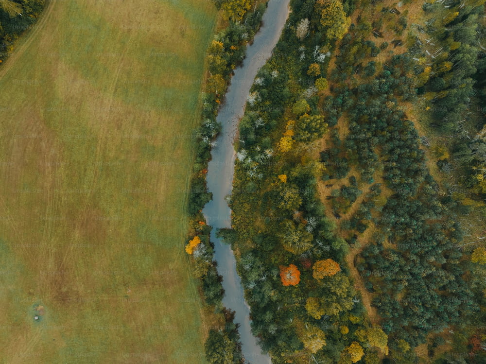 an aerial view of a golf course with a river running through it