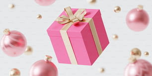 una confezione regalo rosa con un nastro d'oro e un fiocco