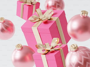 una confezione regalo rosa con nastro d'oro e ornamenti intorno