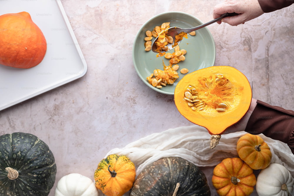 a table topped with pumpkins and squash