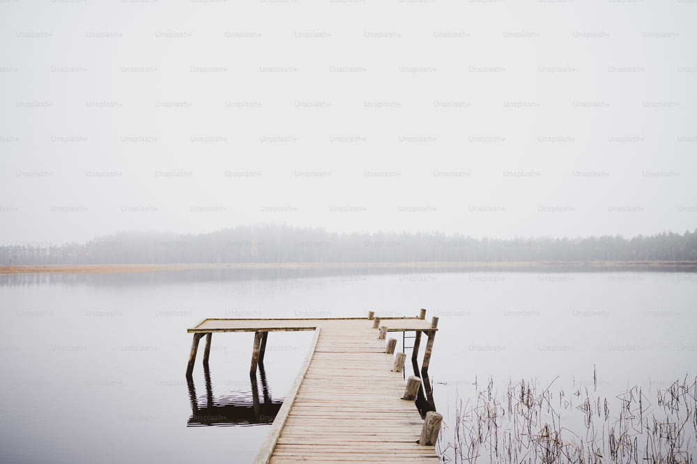 a wooden dock sitting on top of a body of water