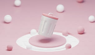 a white cup with a pink lid surrounded by pink and white balls