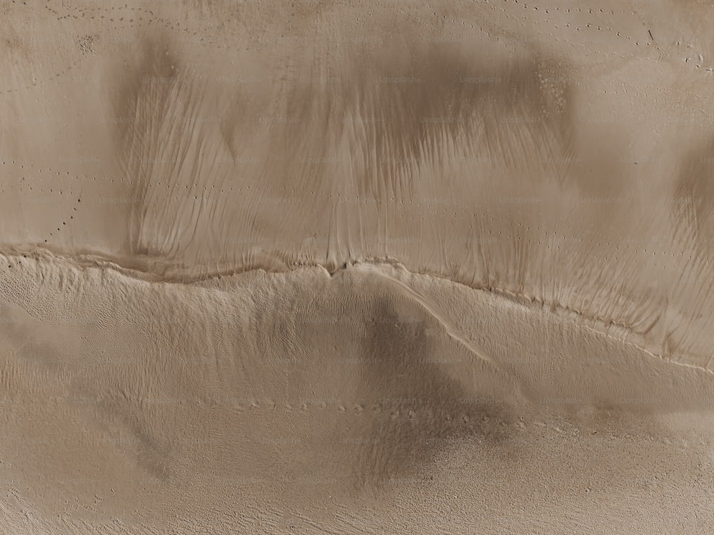 a desert like area with sand and water