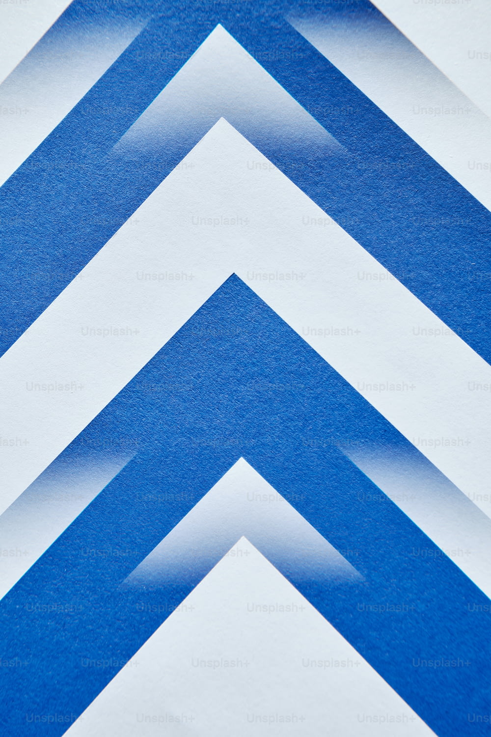 a close up of a blue and white striped wall