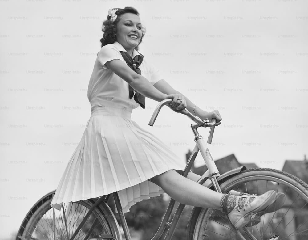 A young woman freewheeling on a bicycle. (Photo by George Marks/Retrofile/Getty Images)