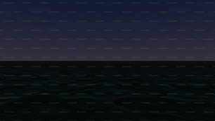 a view of the ocean at night from a boat