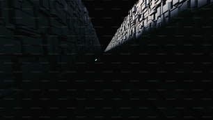 a dark alley with a green light at the end