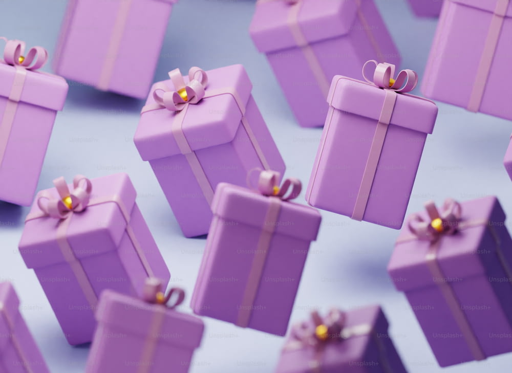 a group of purple gift boxes with bows