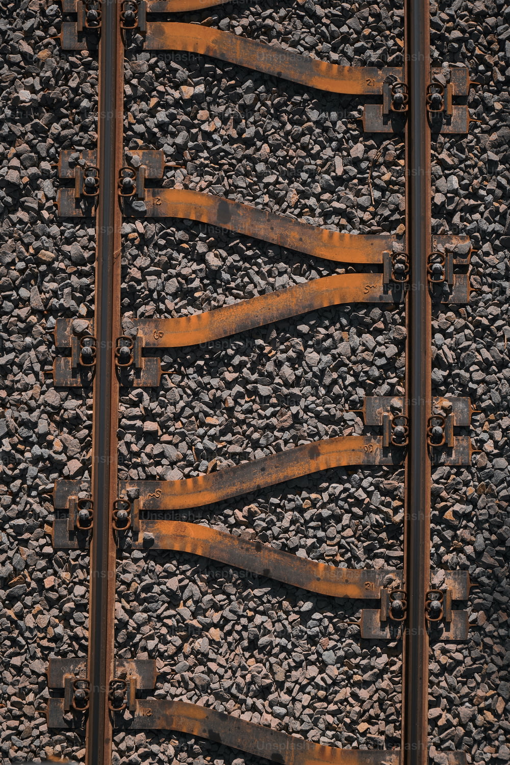 a close up of a train track with rust on it