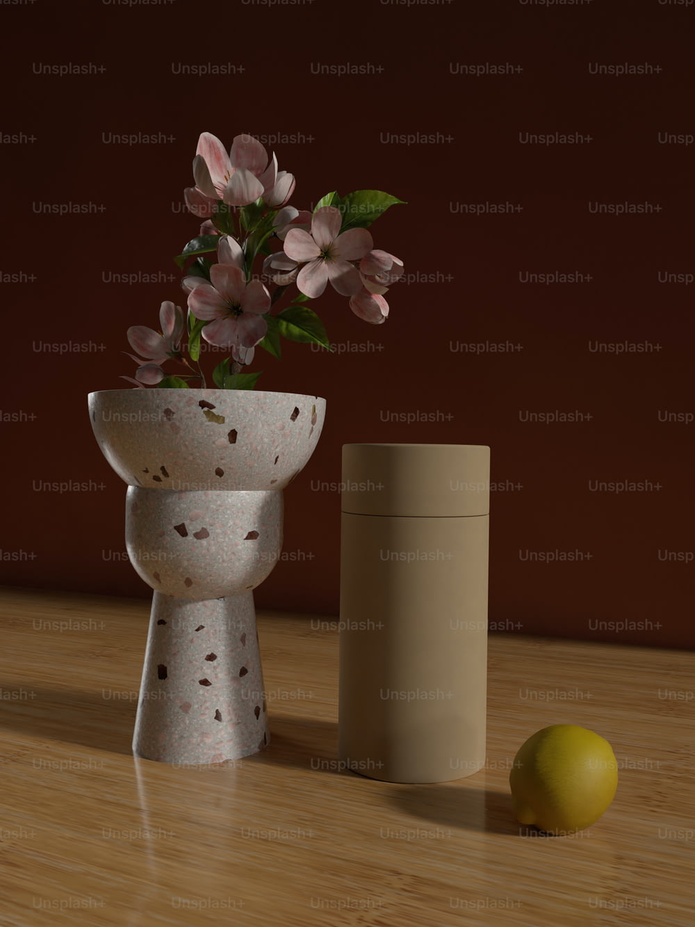 a vase with flowers and a lemon on a table