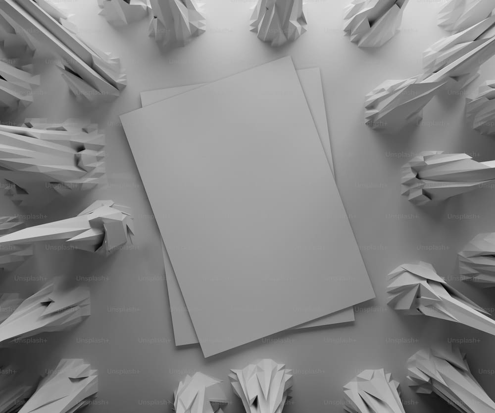 uma folha de papel branca rodeada por pedaços de papel