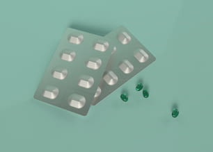 two pills and three green pills on a green background