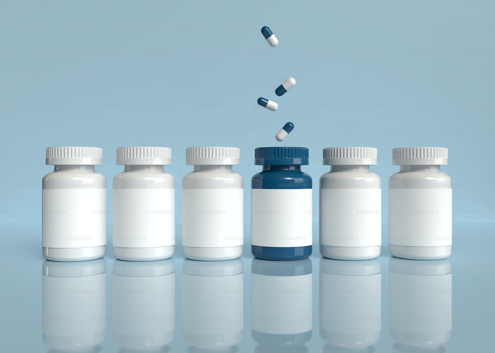 a row of white and blue bottles with pills coming out of them