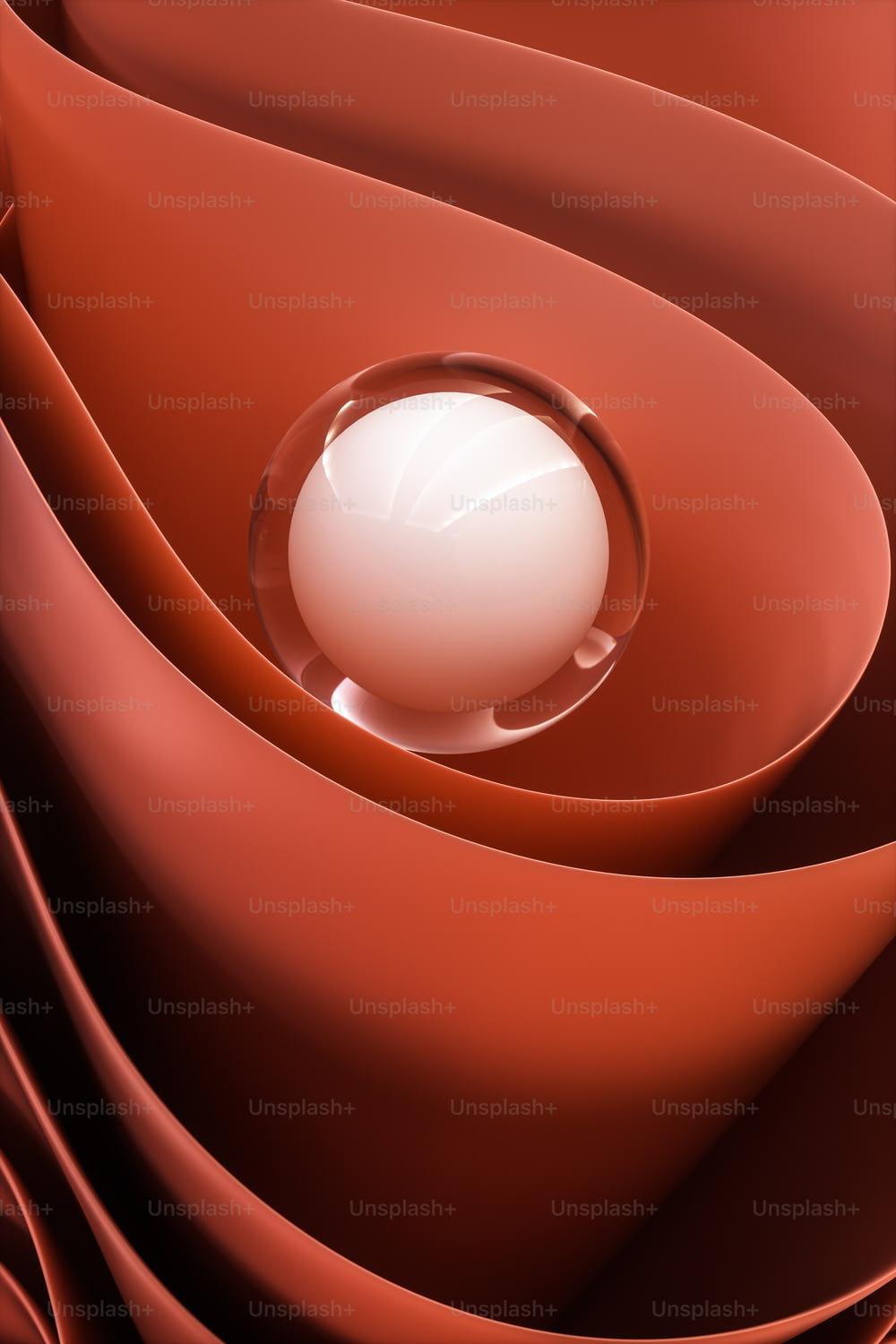 uma bola branca sentada em cima de um objeto vermelho