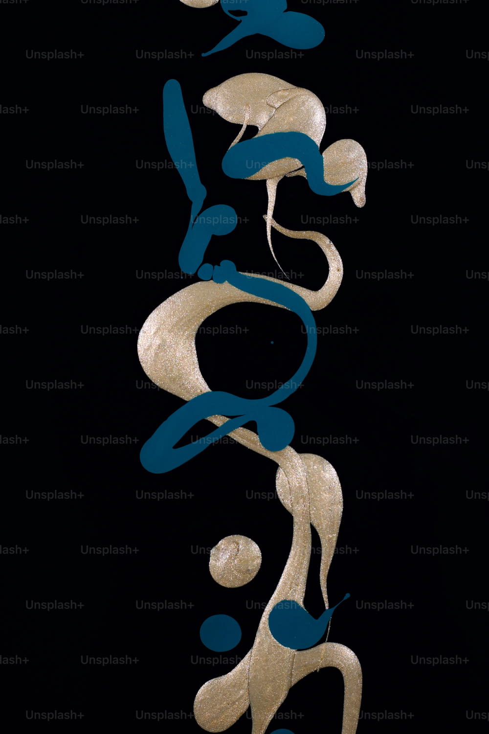 a black background with gold and blue shapes