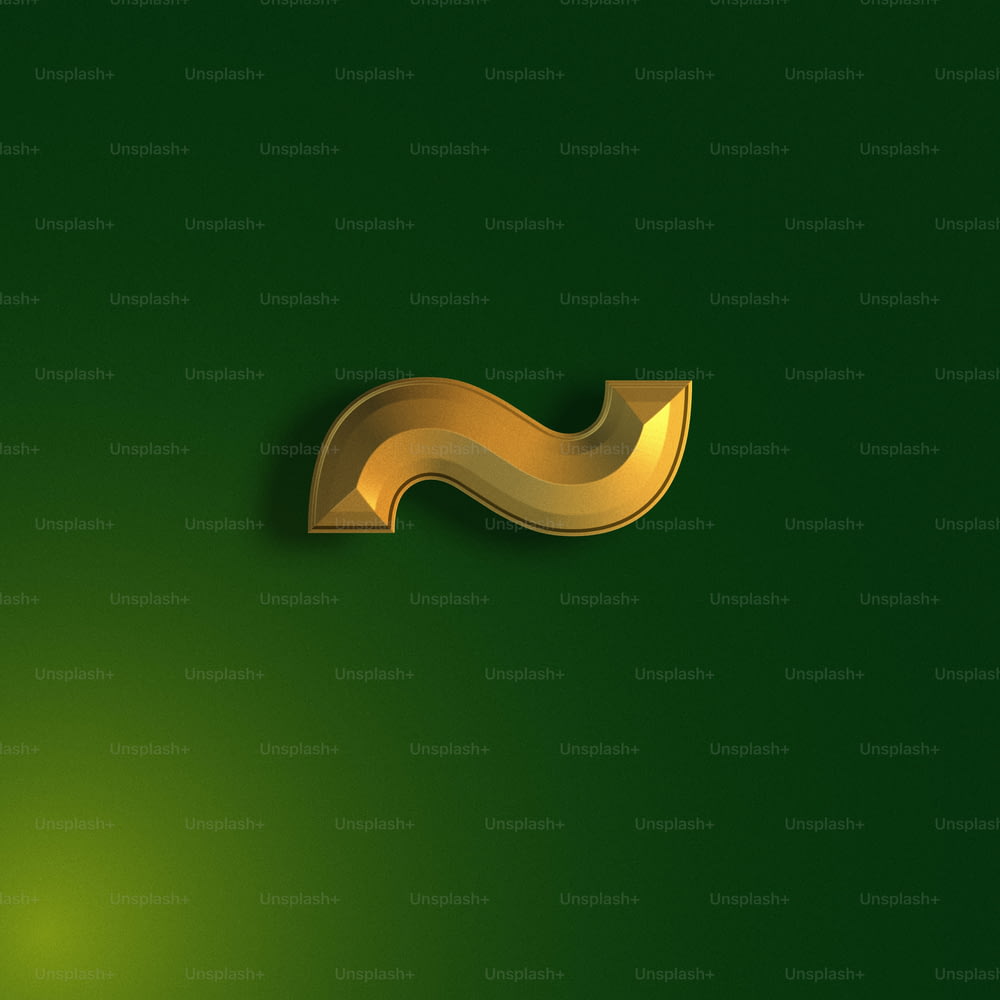 a green background with a gold curved object