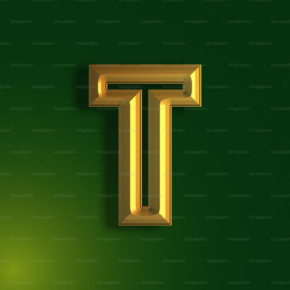 a gold letter t on a green background