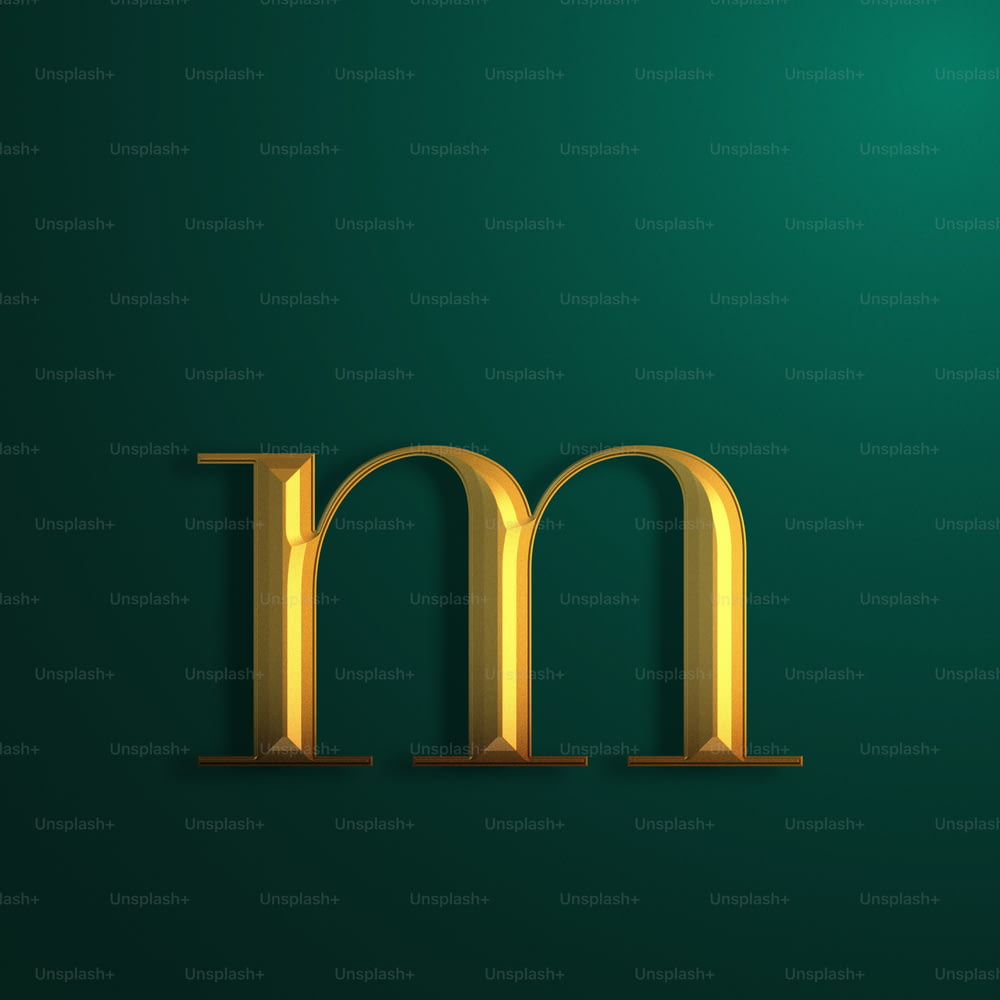 a gold letter m on a green background