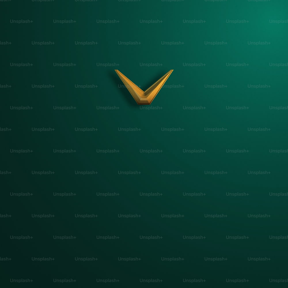 a green wall with a gold v on it