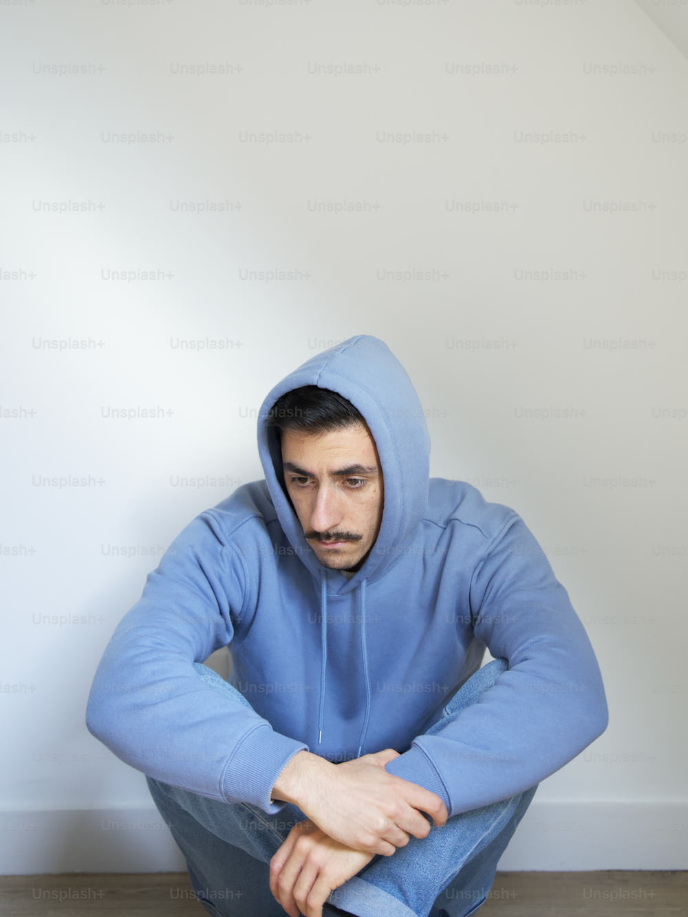 a person in a blue hoodie
