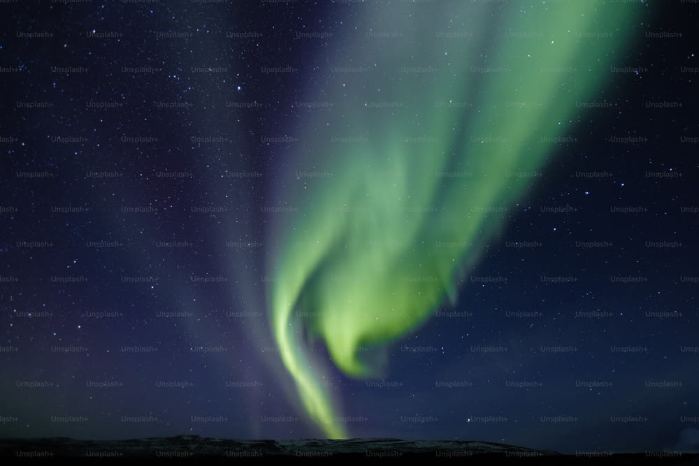a green aurora borealis in the sky