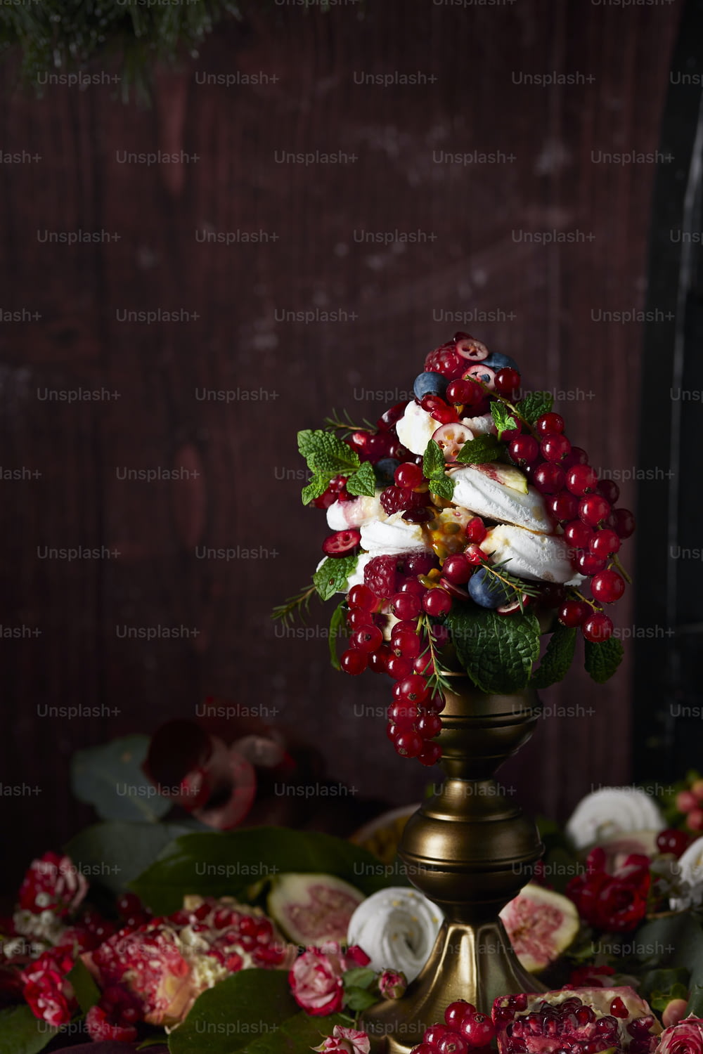 a vase with red berries