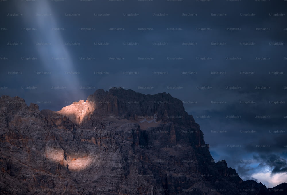a mountain with a light shining on it