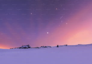 a snowy landscape with a purple sky