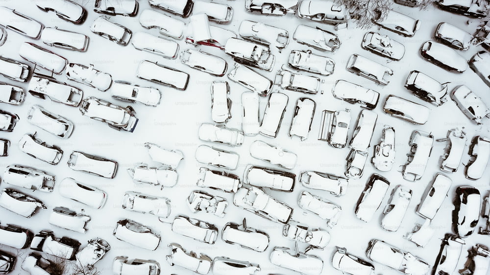 a lot of cars that are covered in snow