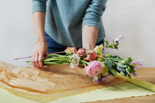 a woman cutting flowers