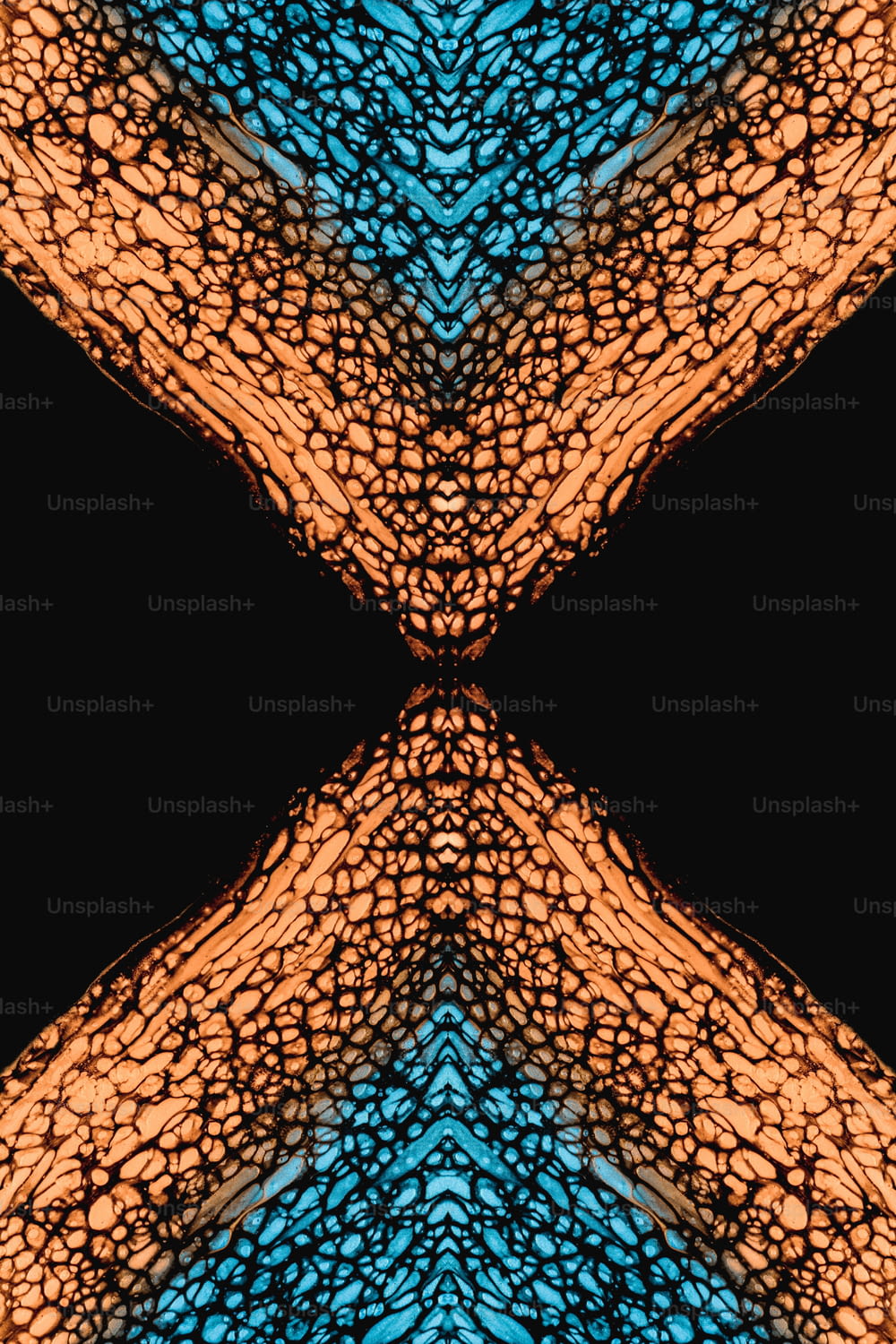a blue and orange pattern with a black background