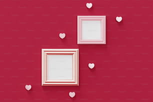 two frames with hearts on a red wall
