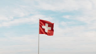하늘 높이 휘날리는 스위스 국기