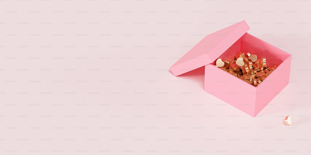 a pink box filled with nuts on top of a table
