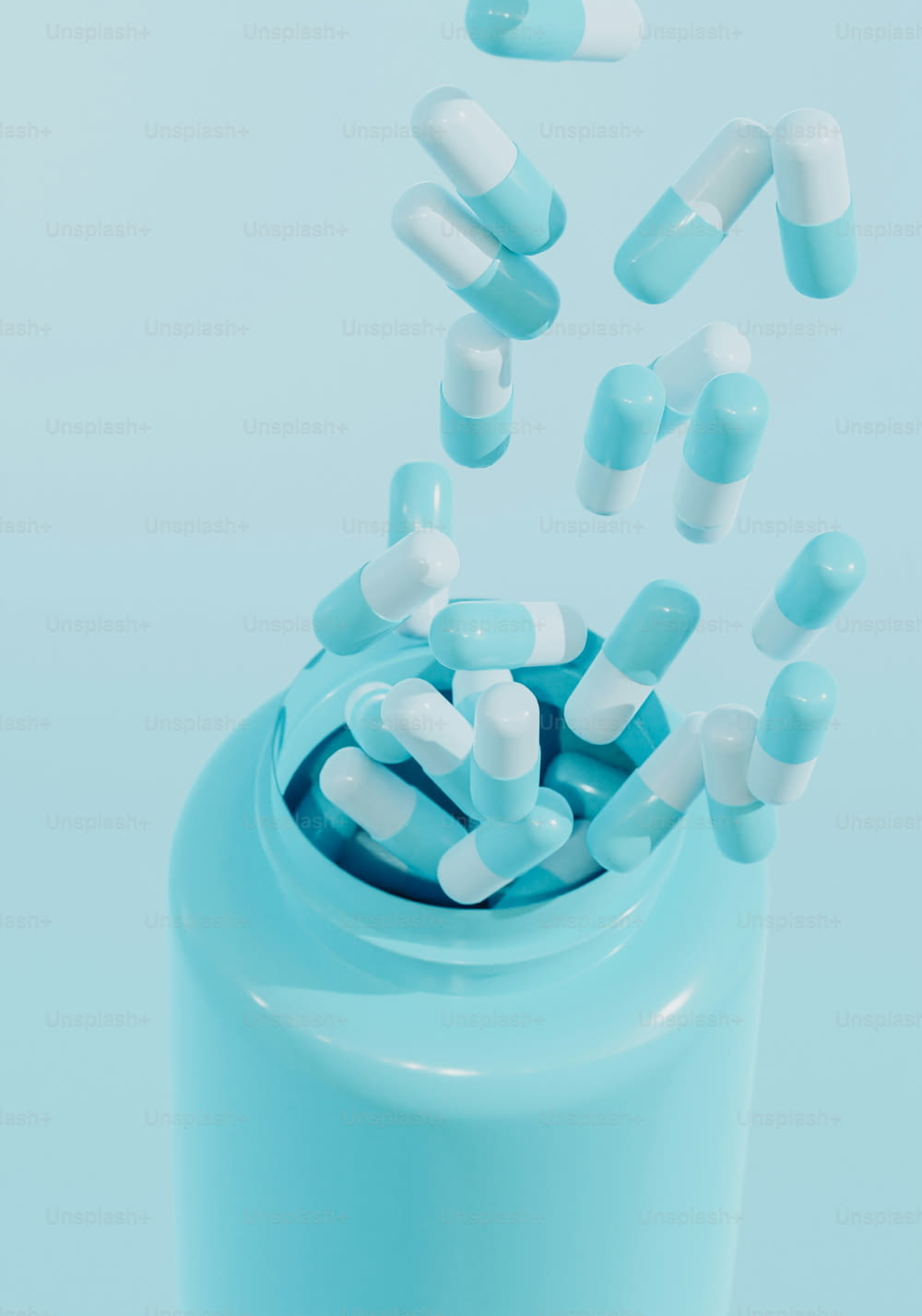pills falling out of a blue pill bottle