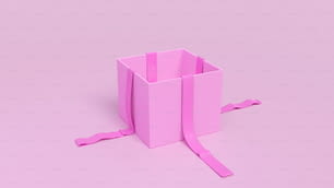 eine rosa Schachtel mit einem Band um sie gebunden