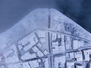an aerial view of a city in the snow