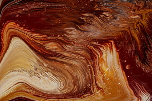 a close up of a brown and white abstract painting