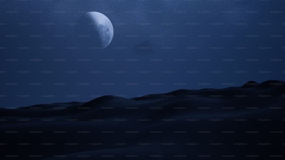 uma vista da lua sobre um deserto à noite