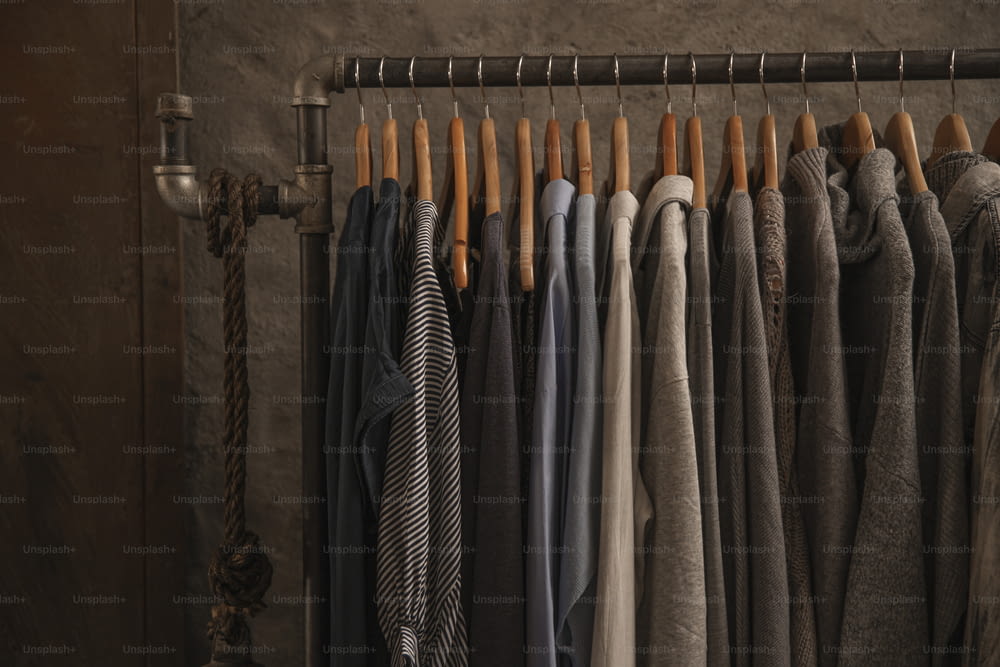 a rack of clothes hanging on a wall