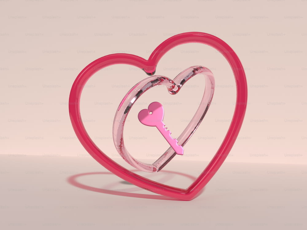 a pink heart shaped object with a key inside of it