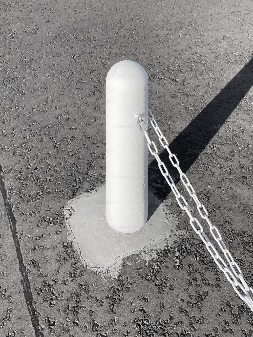 a large white object chained to a pole