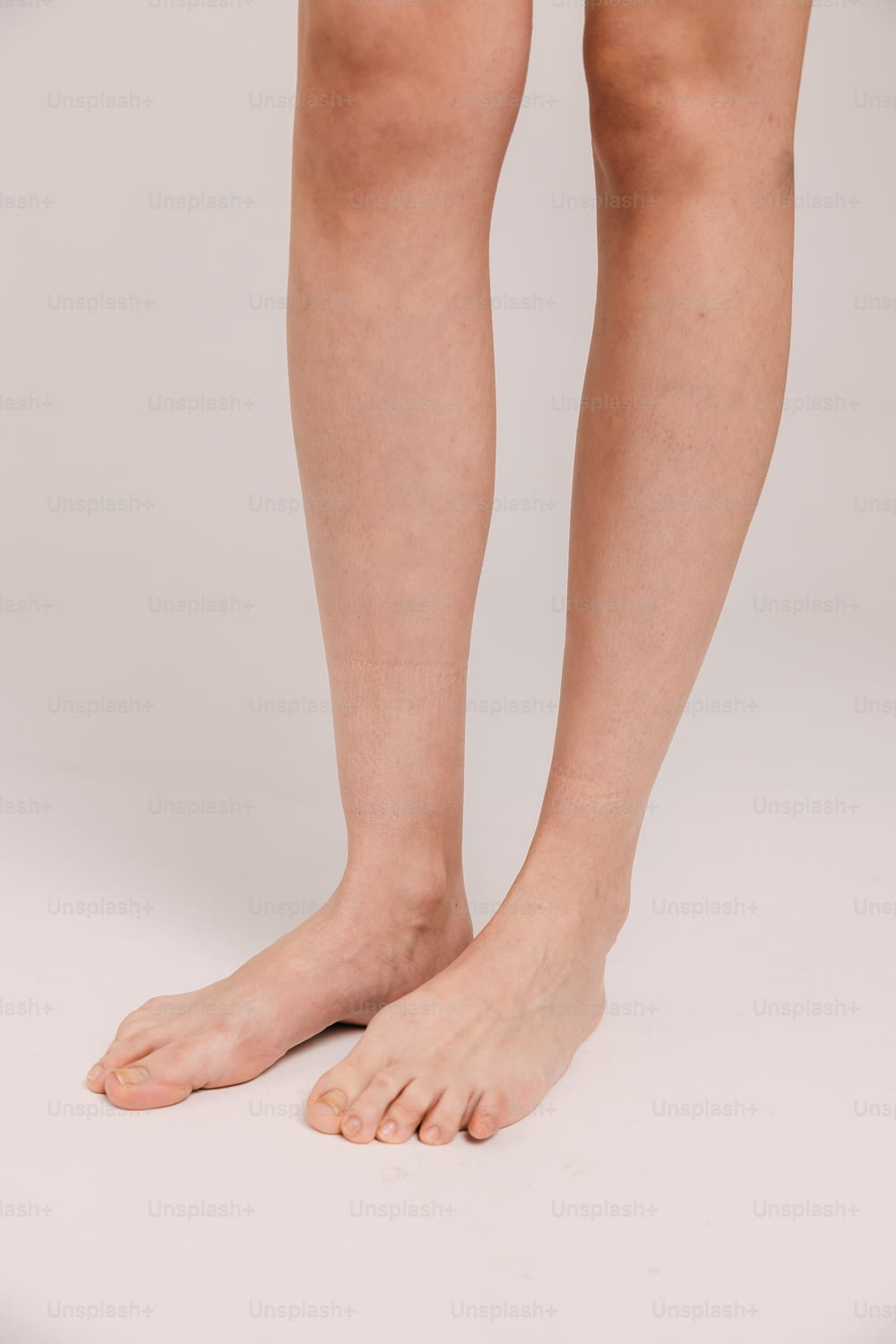 a woman's bare legs and legs are shown