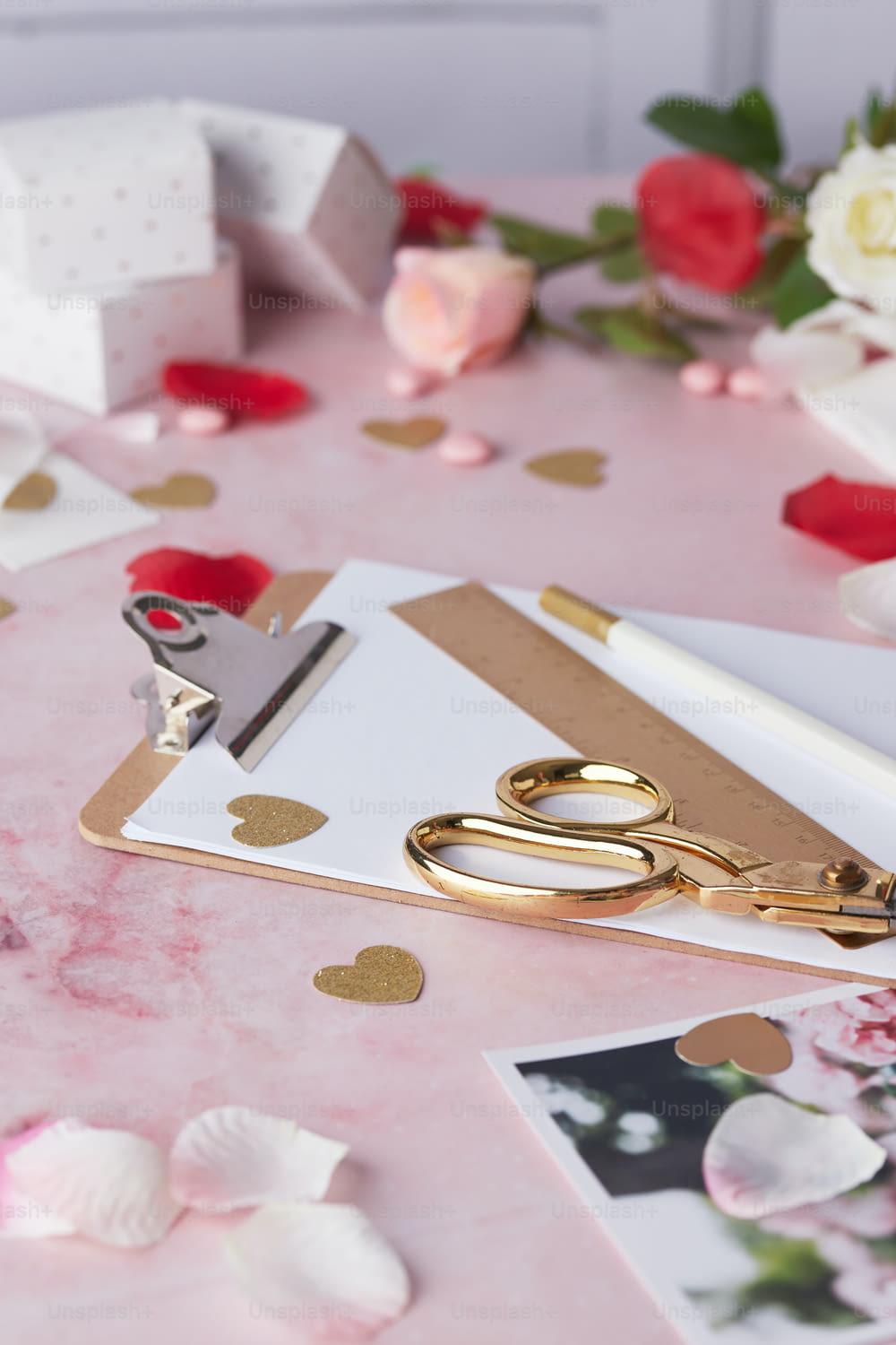a pair of gold scissors sitting on top of a table