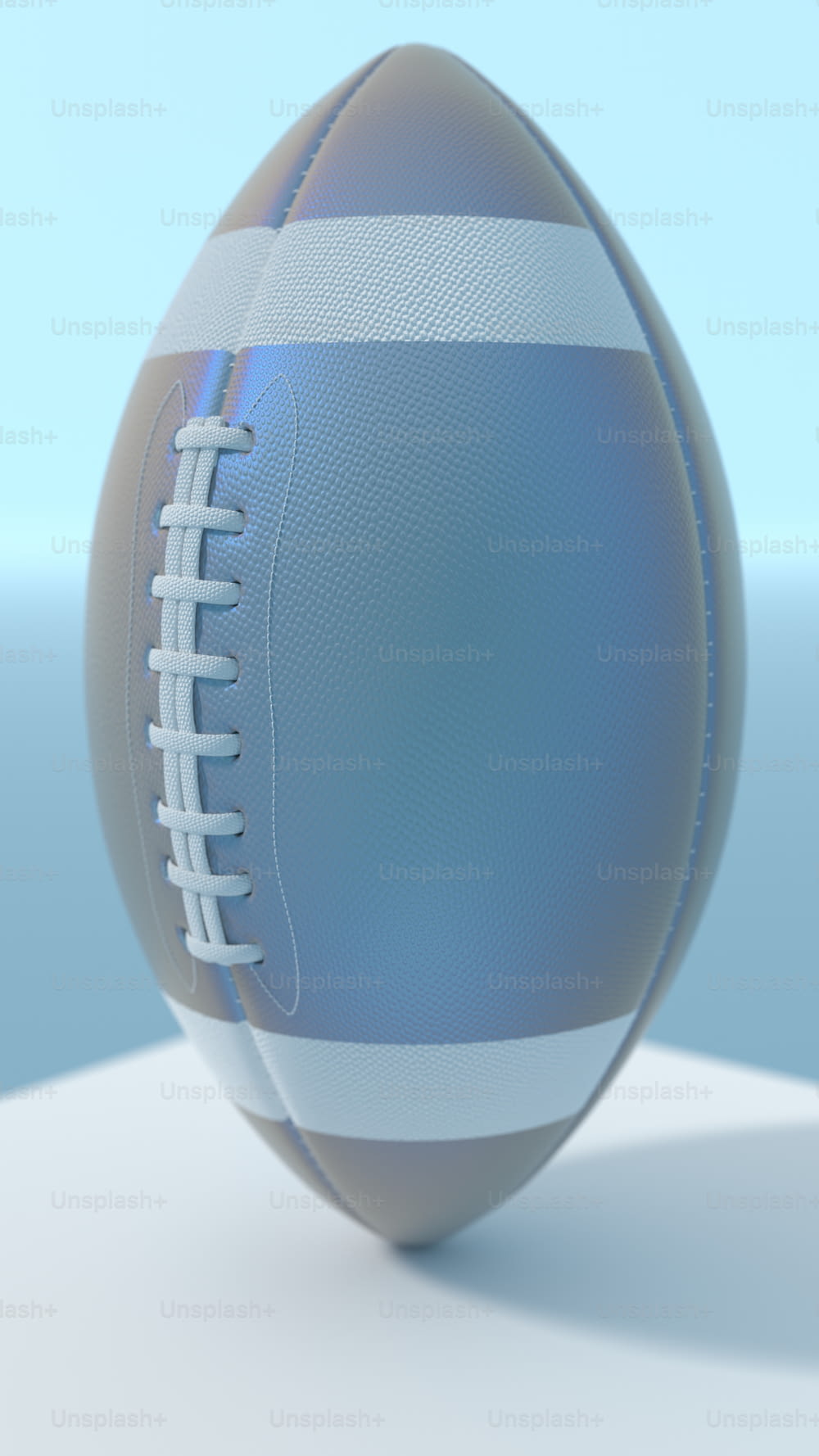 a close up of a football on a white surface