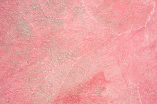Un primer plano de una superficie rosa y gris