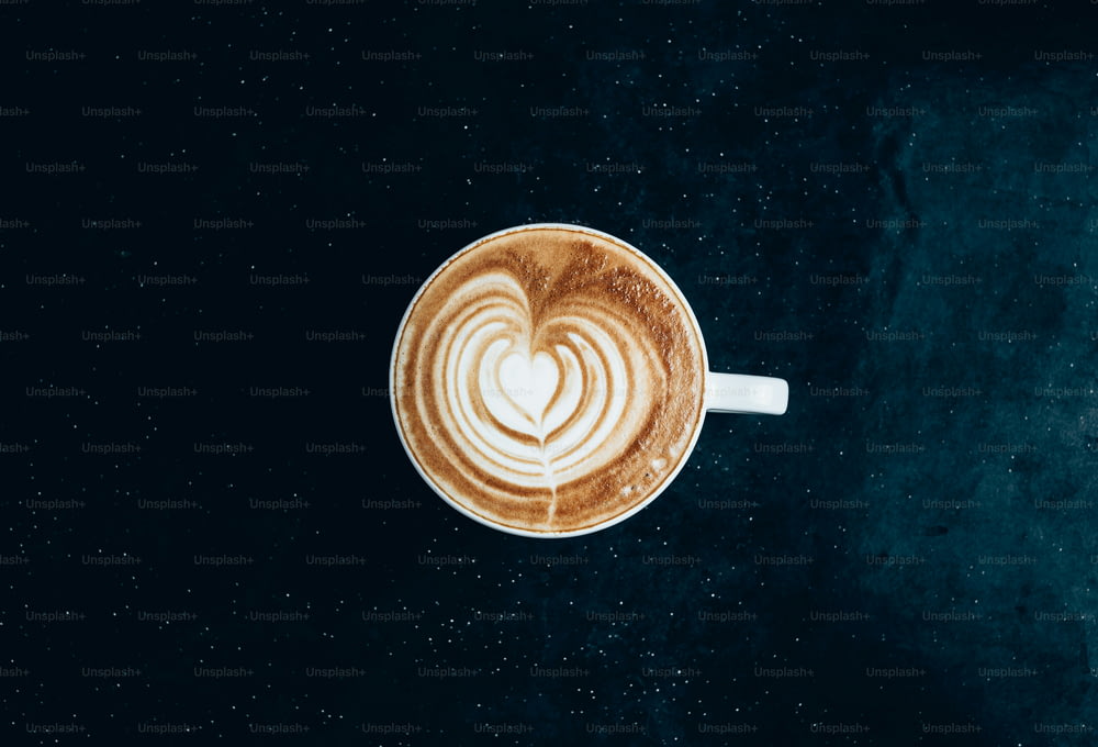 a cappuccino with a heart in the foam